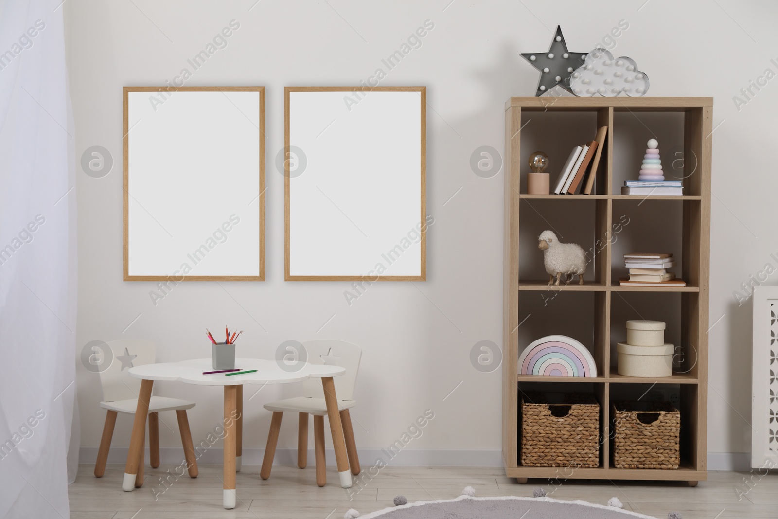 Image of Room for child with blank pictures on wall. Interior design