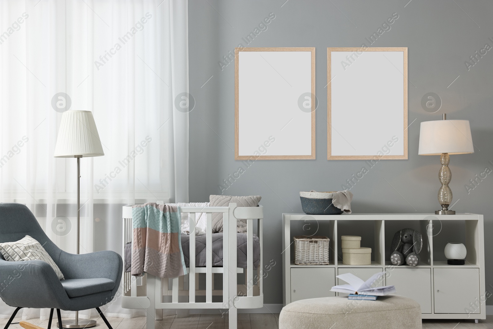 Image of Room for child with blank pictures on grey wall. Interior design