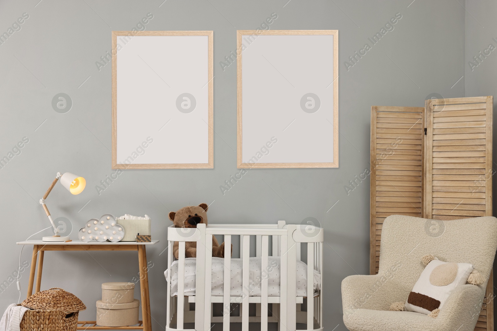 Image of Room for child with blank pictures on grey wall. Interior design