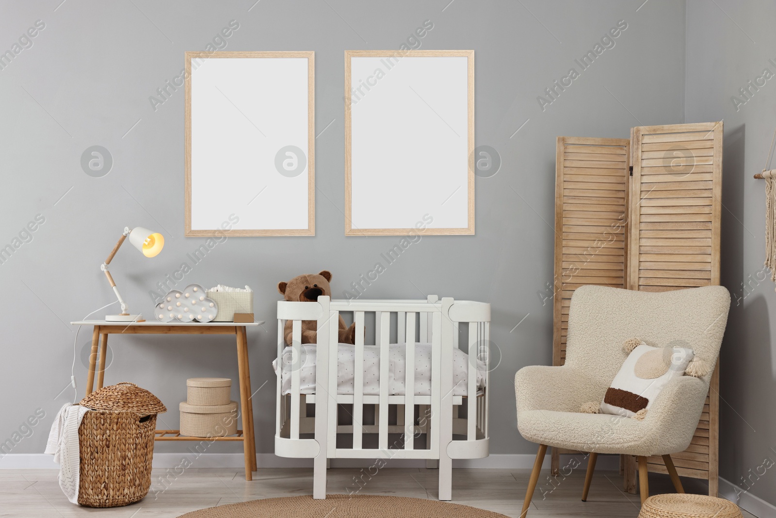 Image of Room for child with blank pictures on grey wall. Interior design