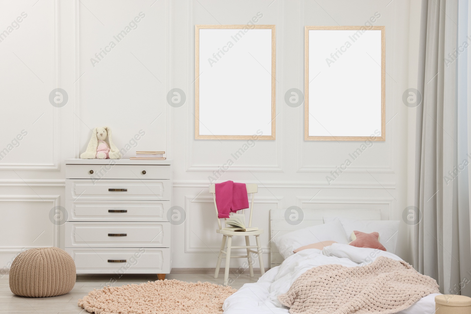 Image of Room for child with blank pictures on wall. Interior design