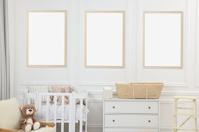 Image of Room for child with blank pictures on wall. Interior design