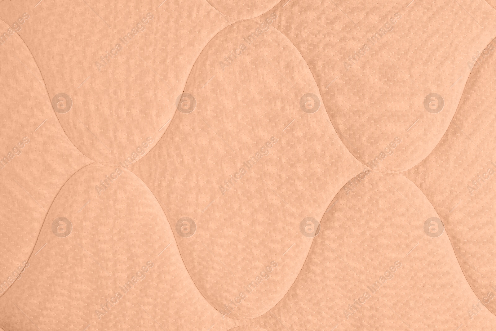 Image of Peach fuzz color textile surface, closeup. Trendy shade of 2024 year