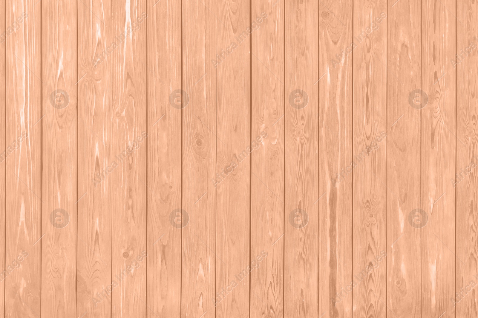 Image of Wooden surface of peach fuzz color, top view. Trendy shade of 2024 year