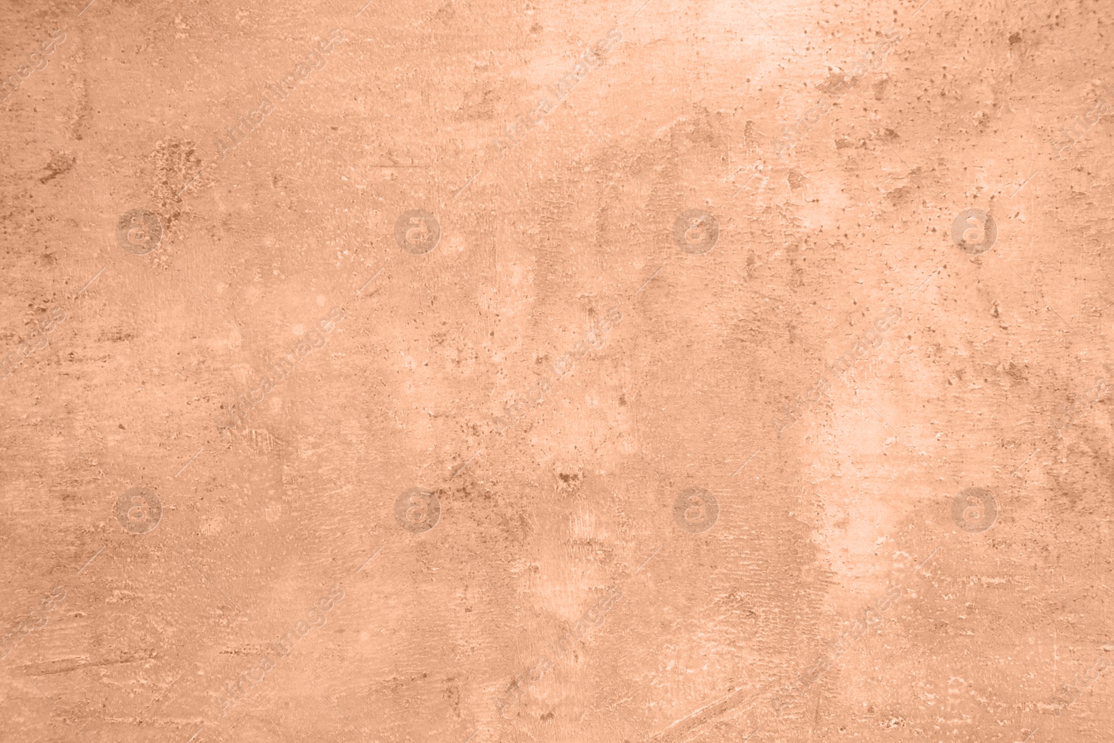 Image of Stone surface of peach fuzz color, top view. Trendy shade of 2024 year