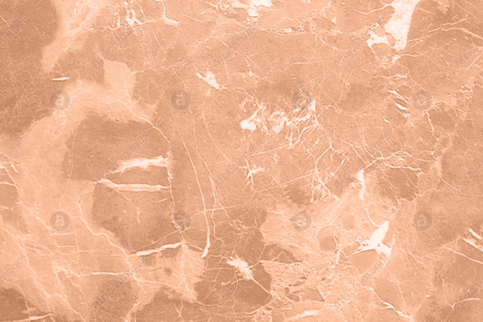 Image of Stone surface of peach fuzz color, top view. Trendy shade of 2024 year