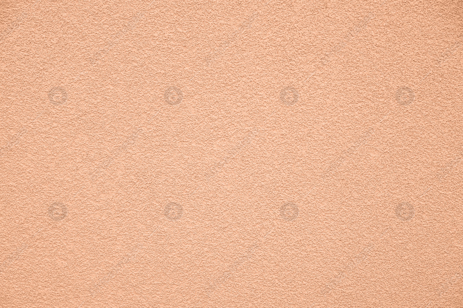 Image of Peach fuzz textured surface, closeup. Trendy shade of 2024 year