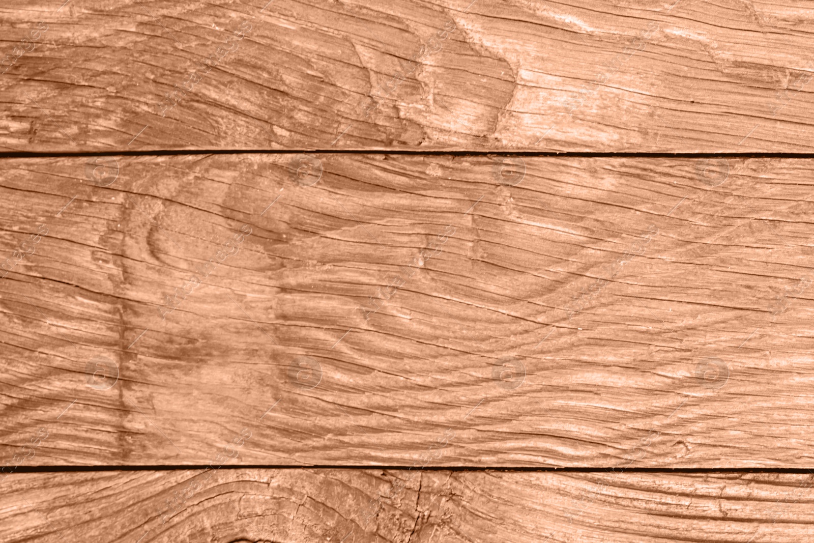 Image of Wooden surface of peach fuzz color, top view. Trendy shade of 2024 year