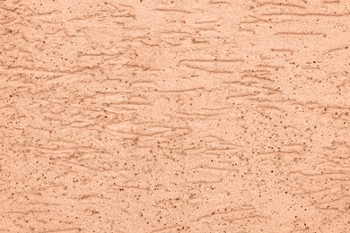Image of Peach fuzz textured surface, closeup. Trendy shade of 2024 year