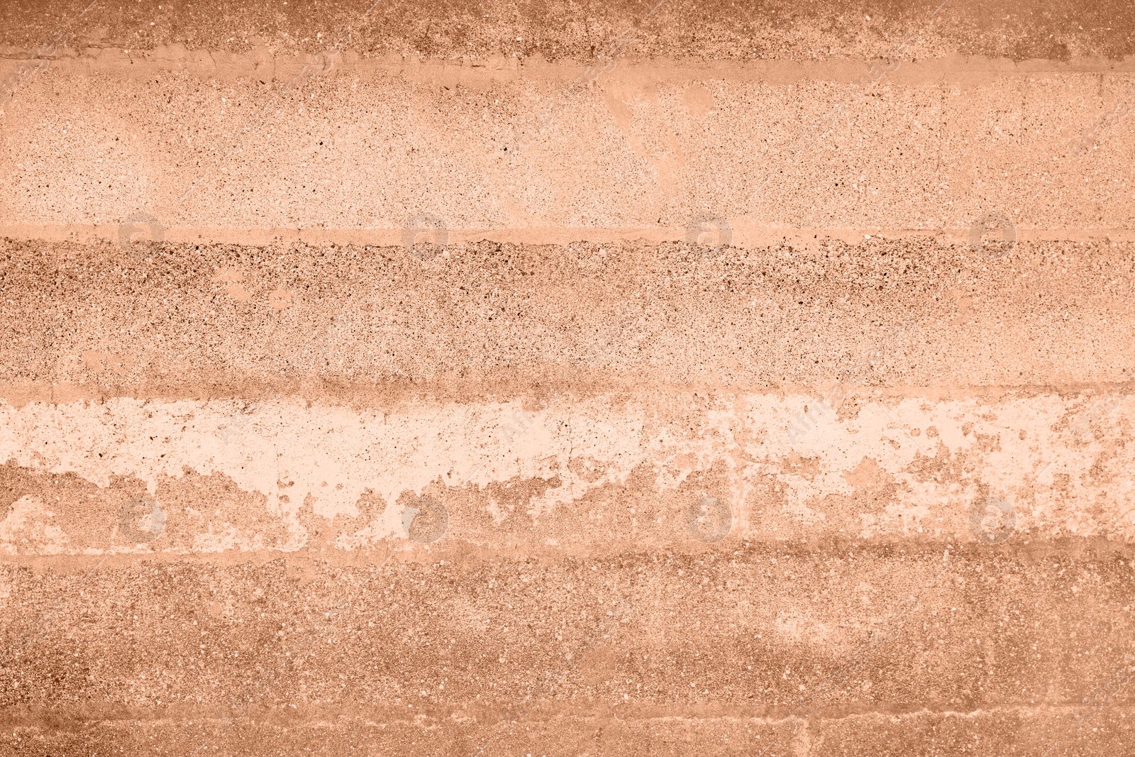 Image of Stone surface of peach fuzz color, top view. Trendy shade of 2024 year