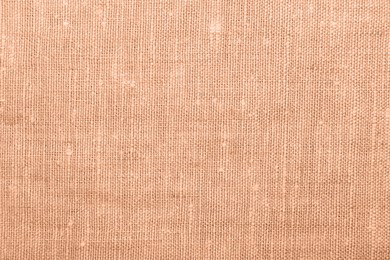 Peach fuzz color fabric, top view. Trendy shade of 2024 year