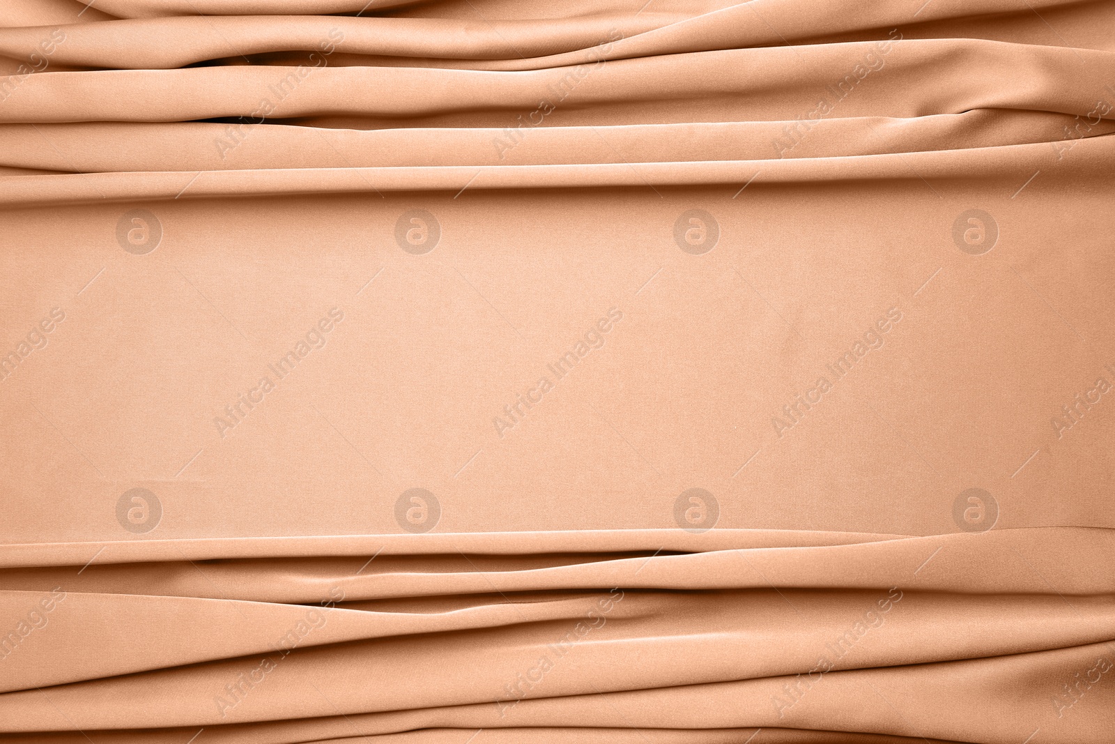 Image of Peach fuzz color silk, top view. Trendy shade of 2024 year