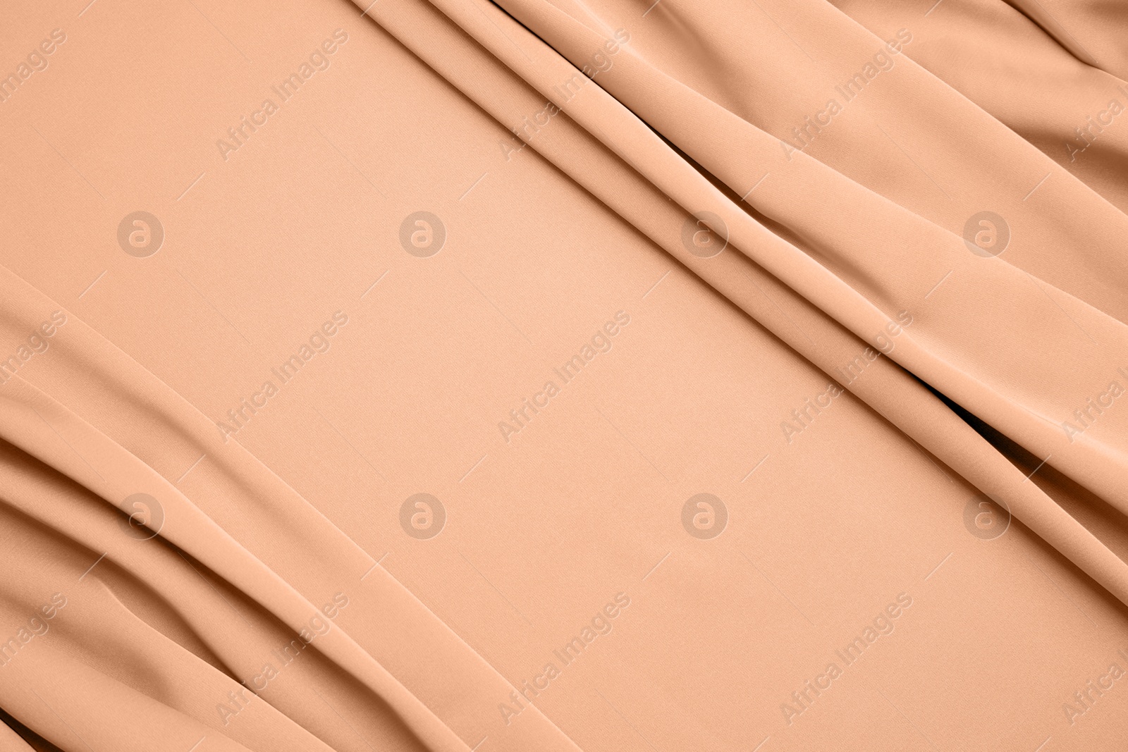 Image of Peach fuzz color silk, top view. Trendy shade of 2024 year