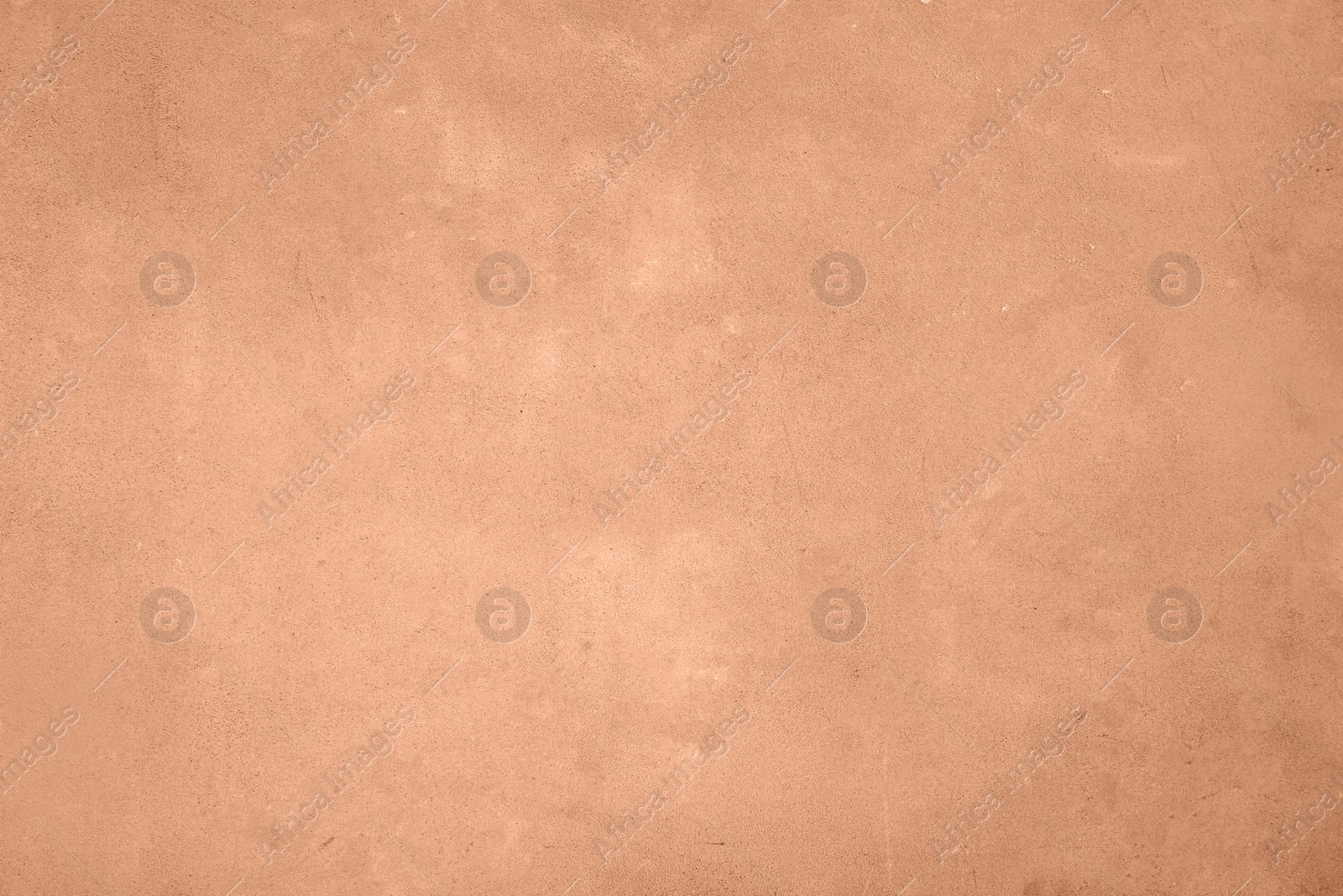 Image of Stone surface of peach fuzz color, top view. Trendy shade of 2024 year