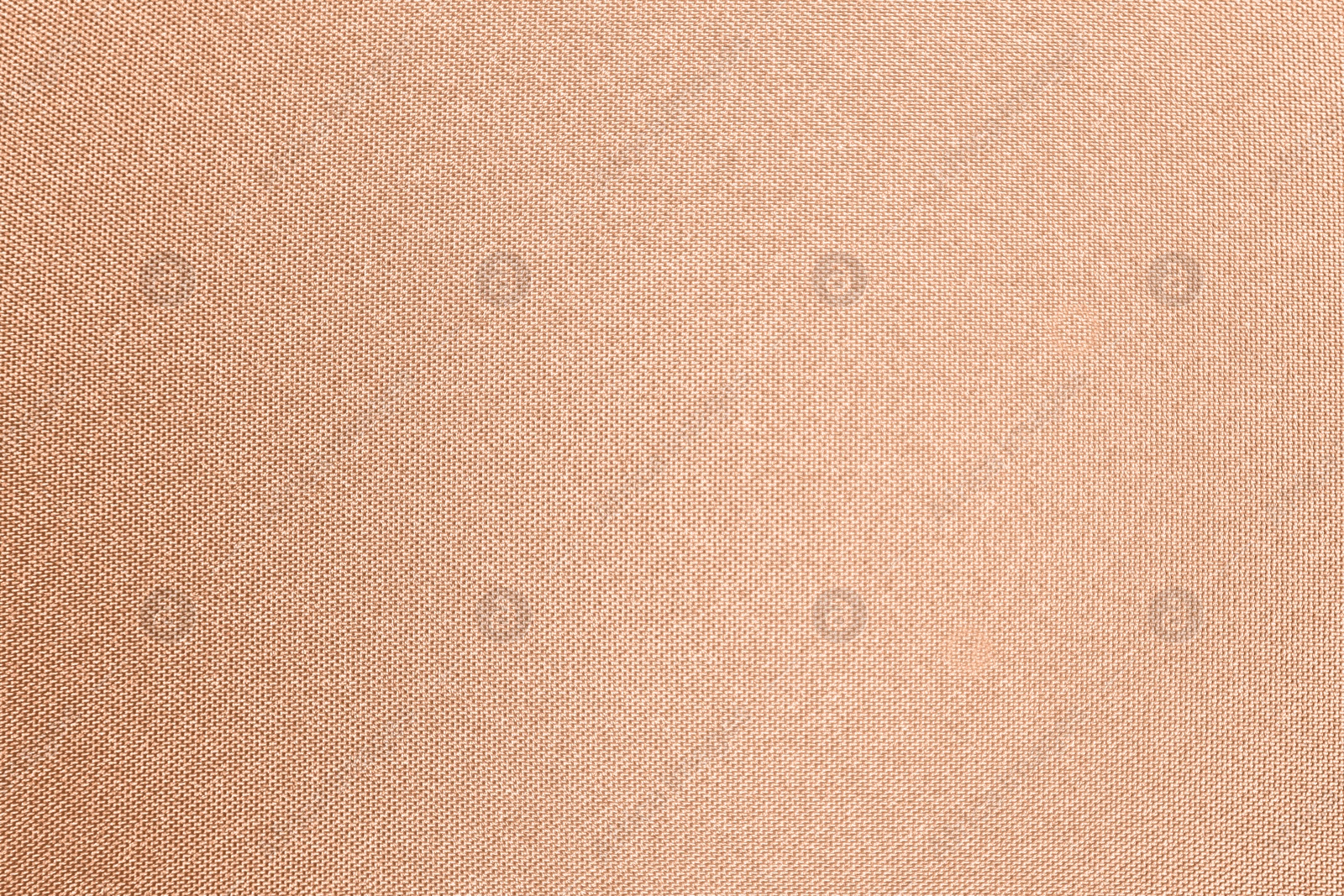 Image of Peach fuzz color fabric, top view. Trendy shade of 2024 year