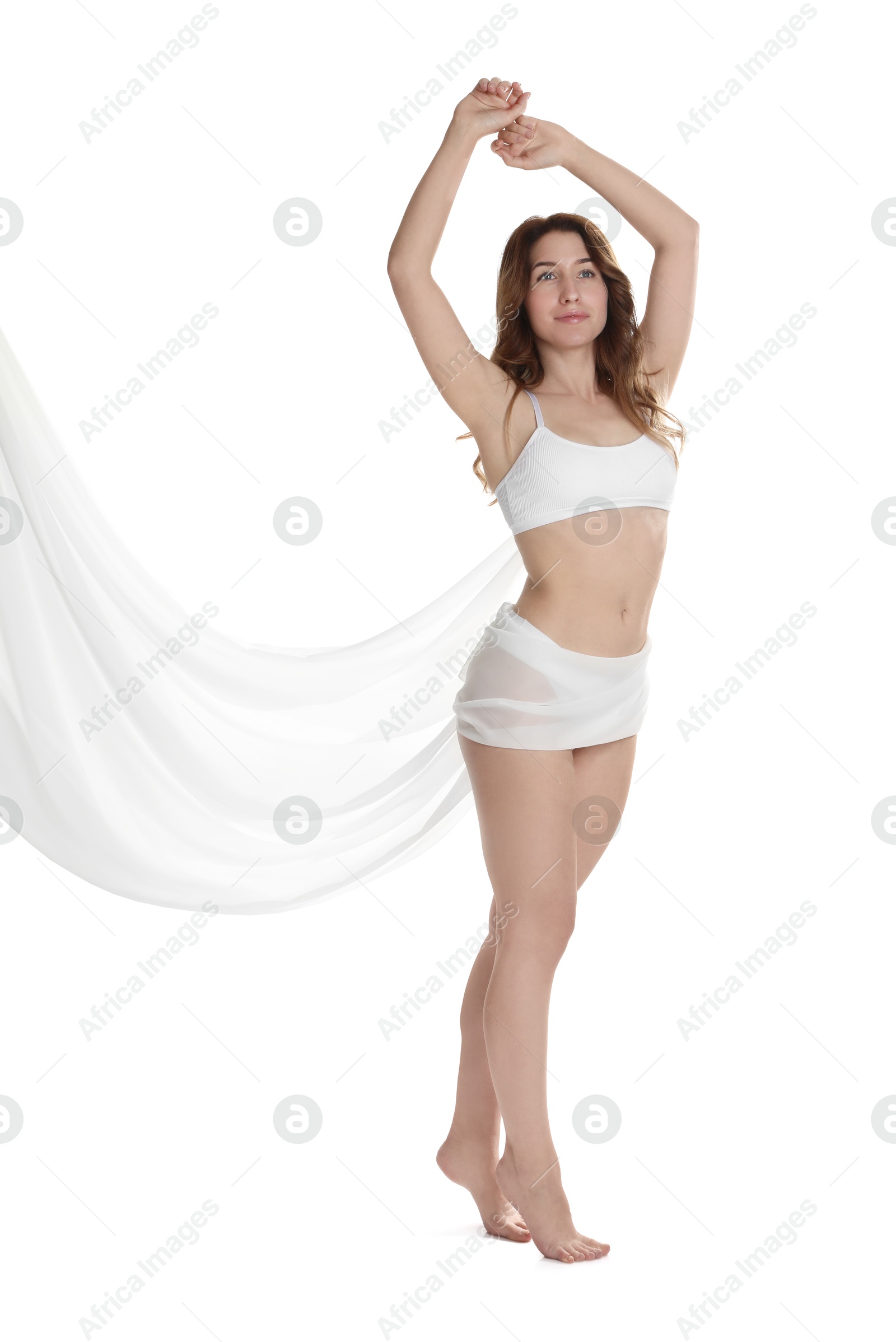 Photo of Woman covering her slim body with silk fabric against white background