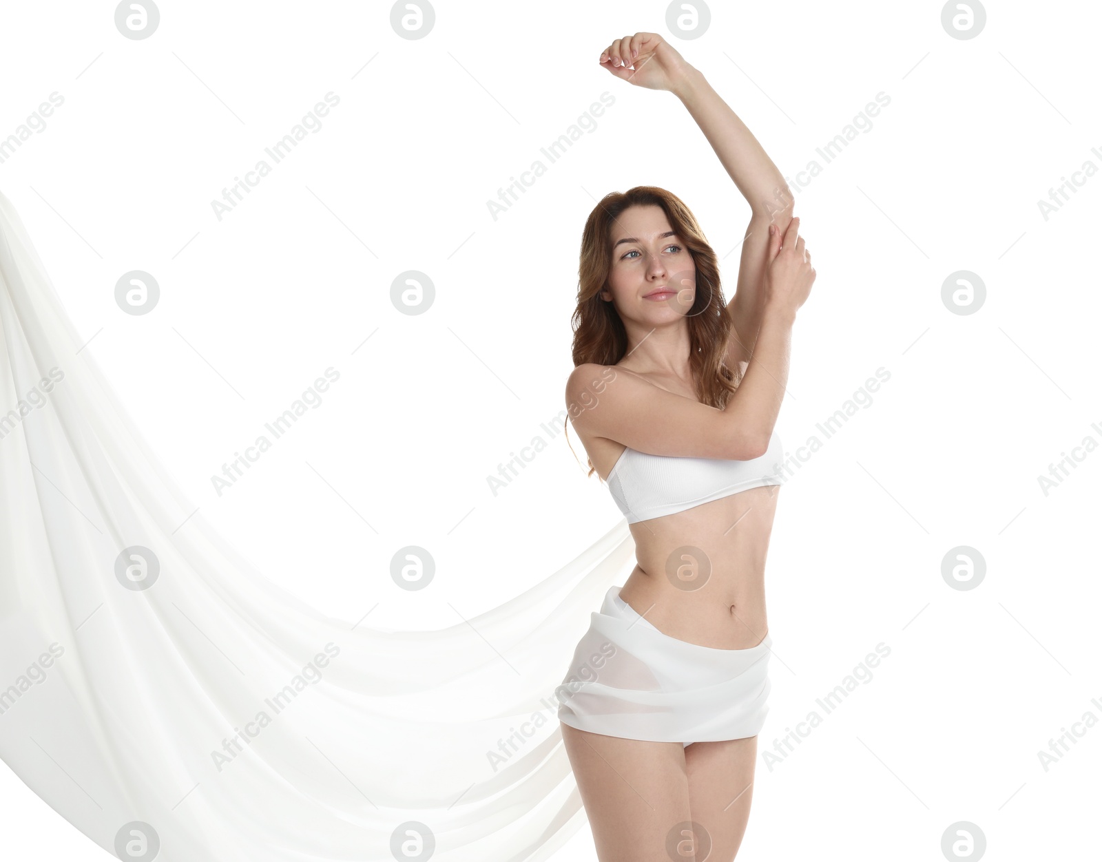 Photo of Woman covering her slim body with silk fabric against white background