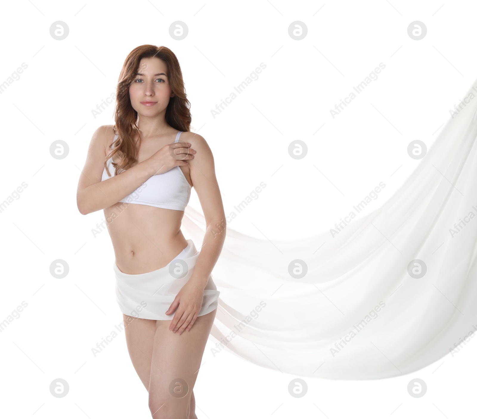 Photo of Woman covering her slim body with silk fabric against white background