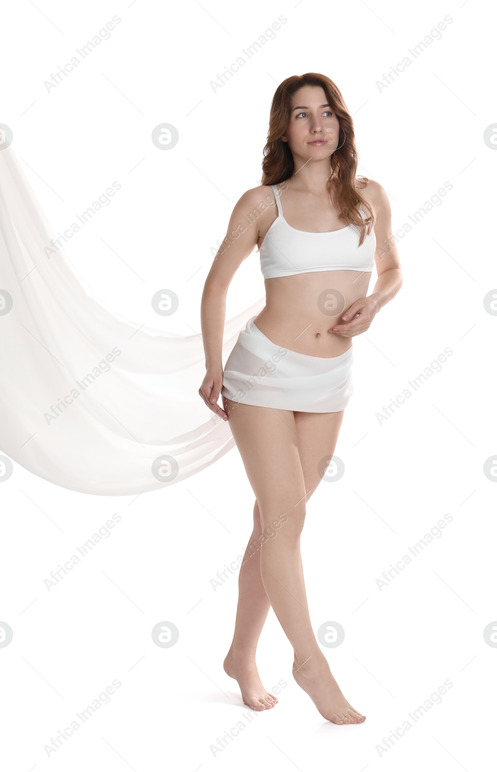 Photo of Woman covering her slim body with silk fabric against white background