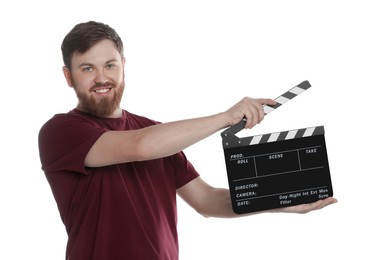 Photo of Making movie. Smiling man with clapperboard on white background