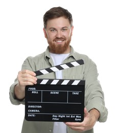 Making movie. Smiling man with clapperboard on white background
