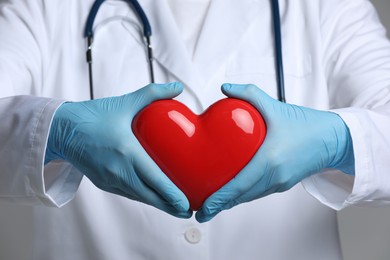 Photo of Doctor with red heart and stethoscope, closeup