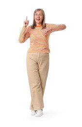 Happy senior woman pointing on white background