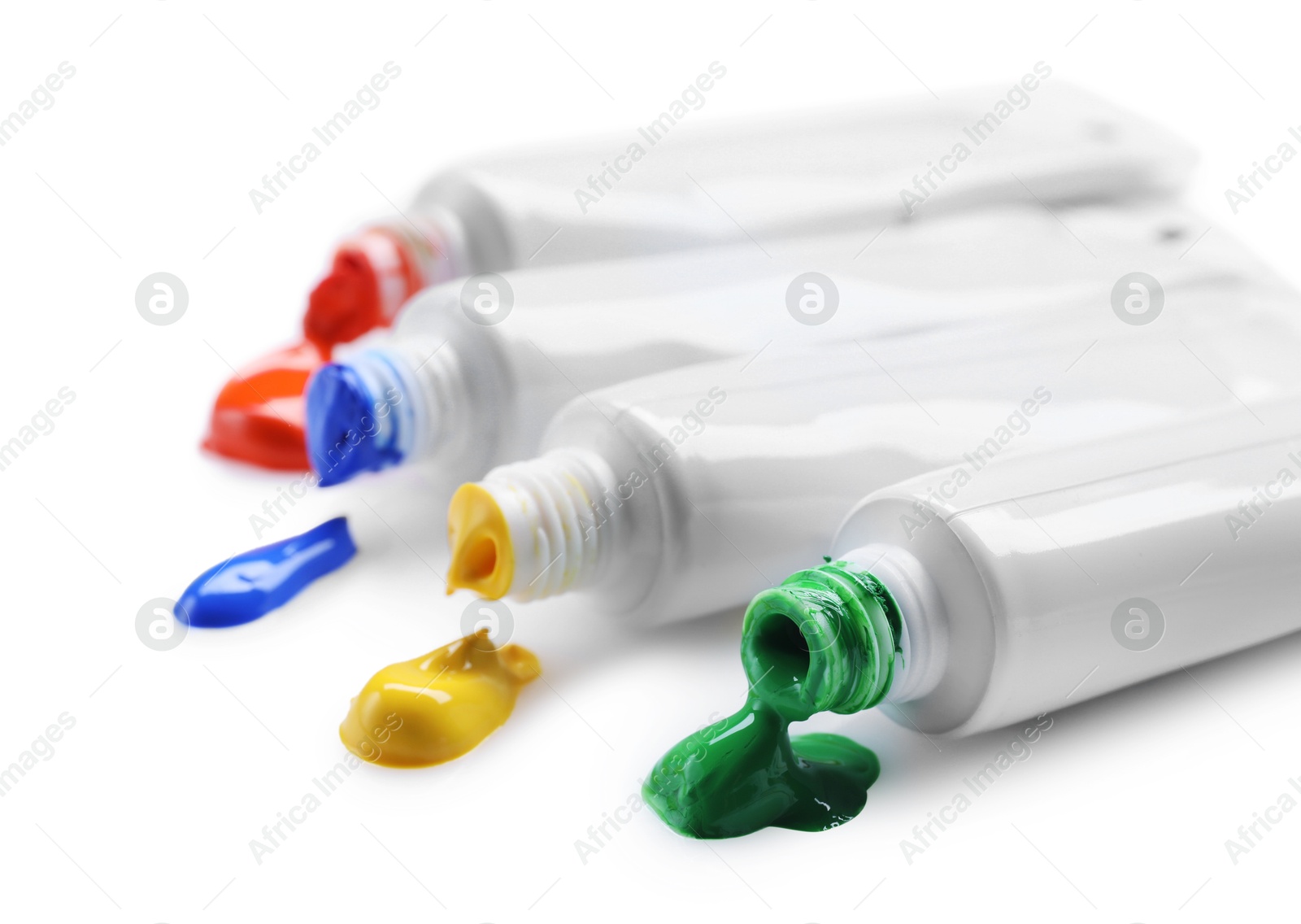 Photo of Many tubes with colorful paints isolated on white