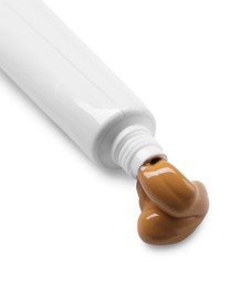 Photo of Tube with brown paint isolated on white