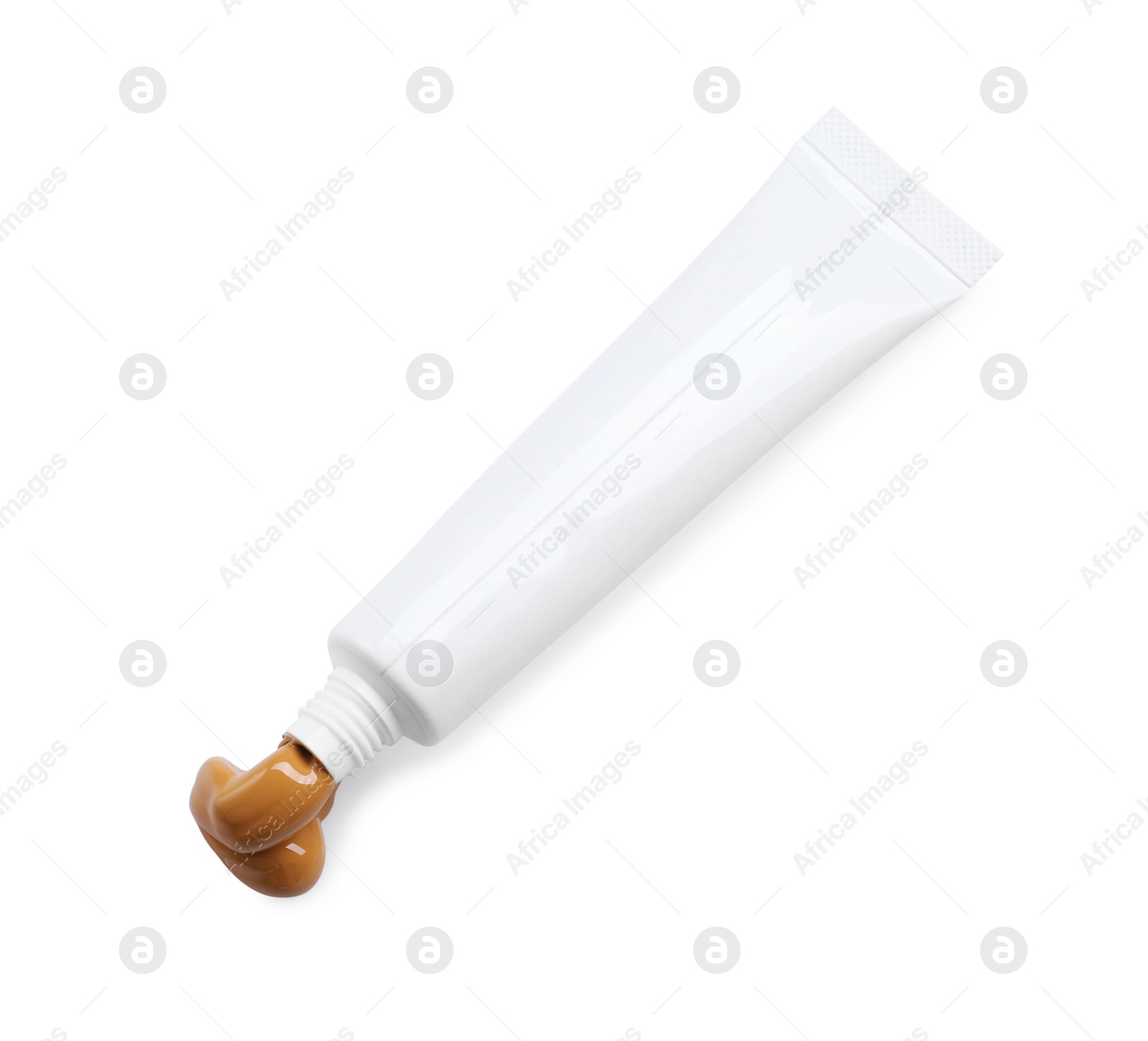 Photo of Tube with brown paint isolated on white, top view