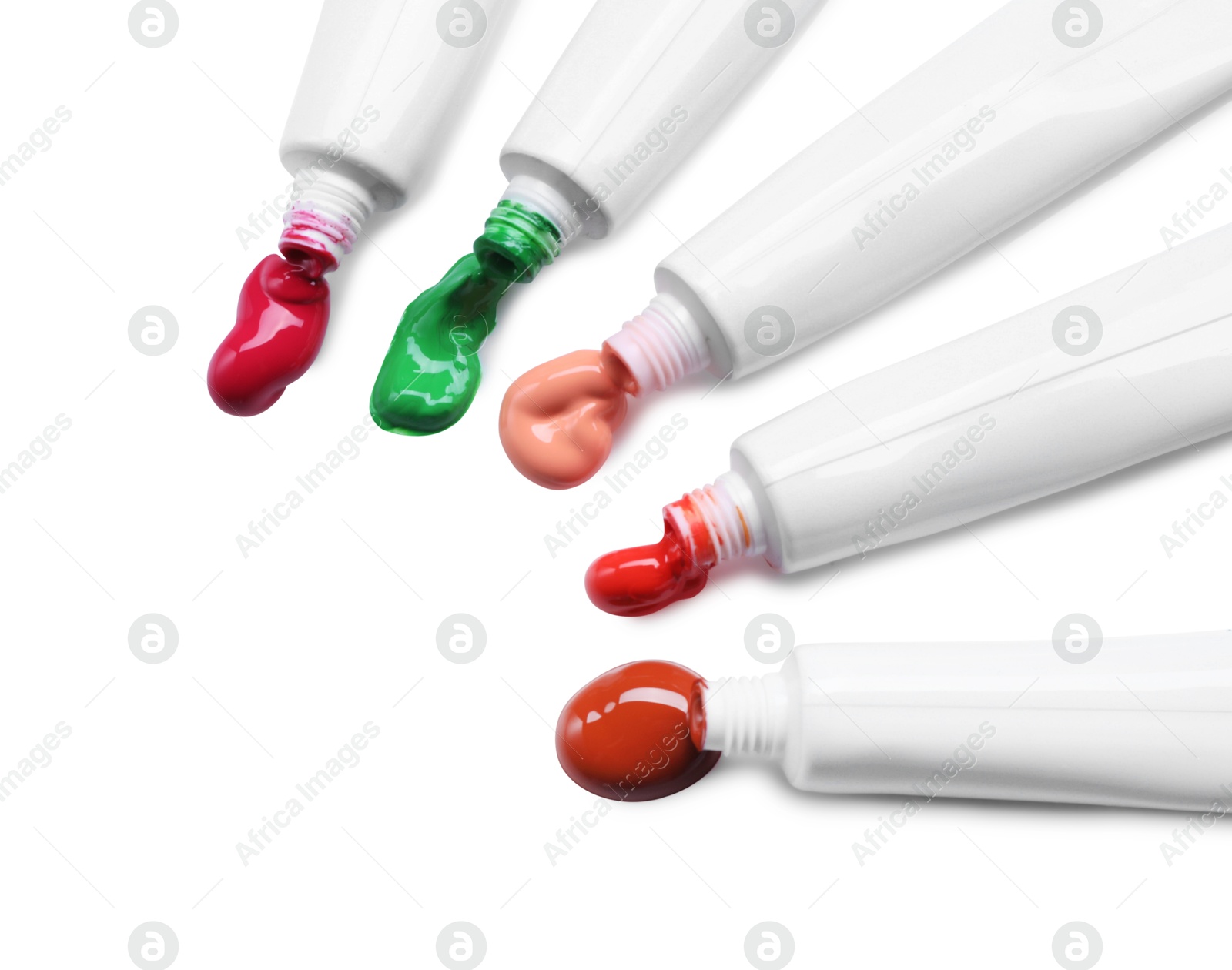 Photo of Tubes with colorful paints isolated on white, top view