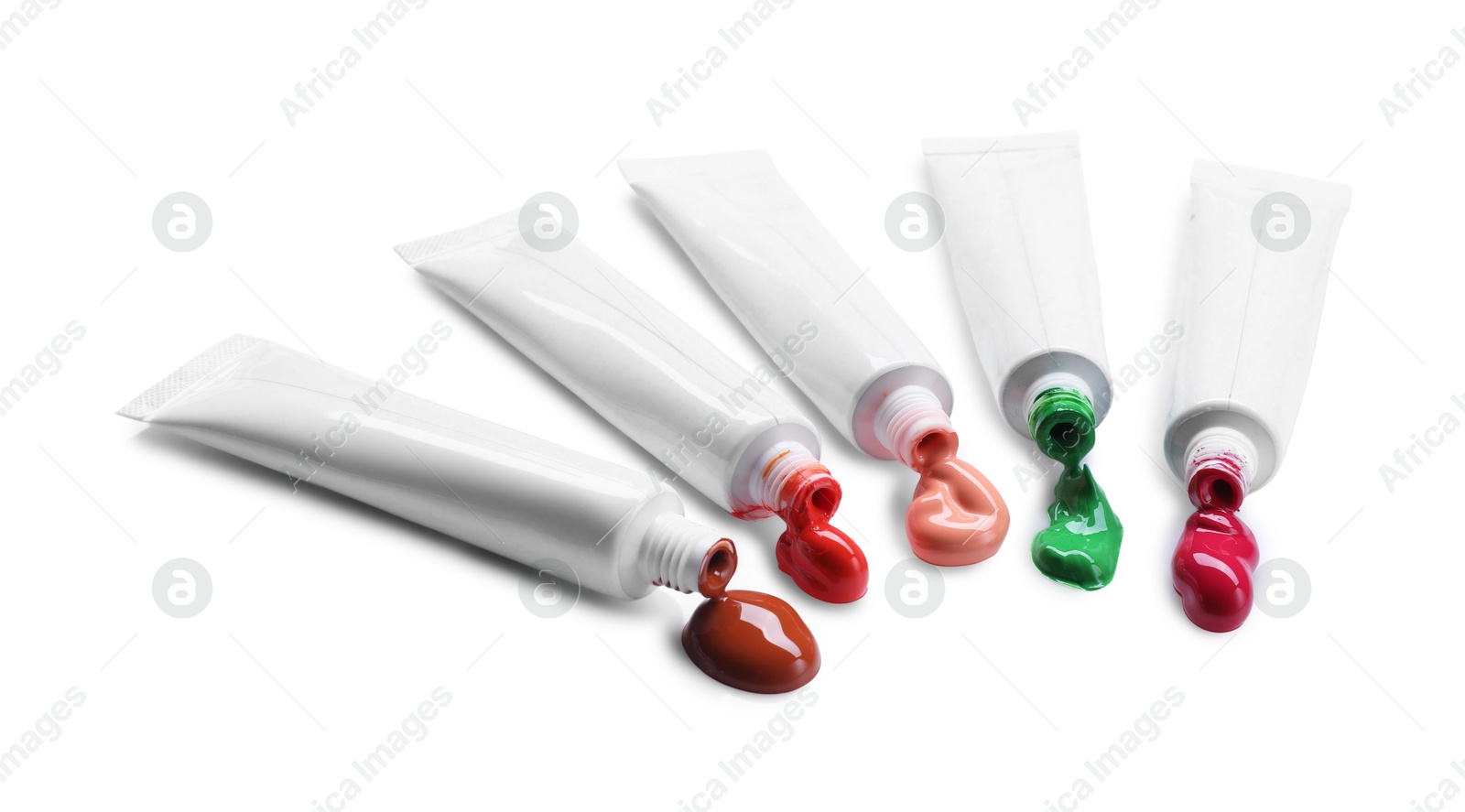 Photo of Many tubes with colorful paints isolated on white