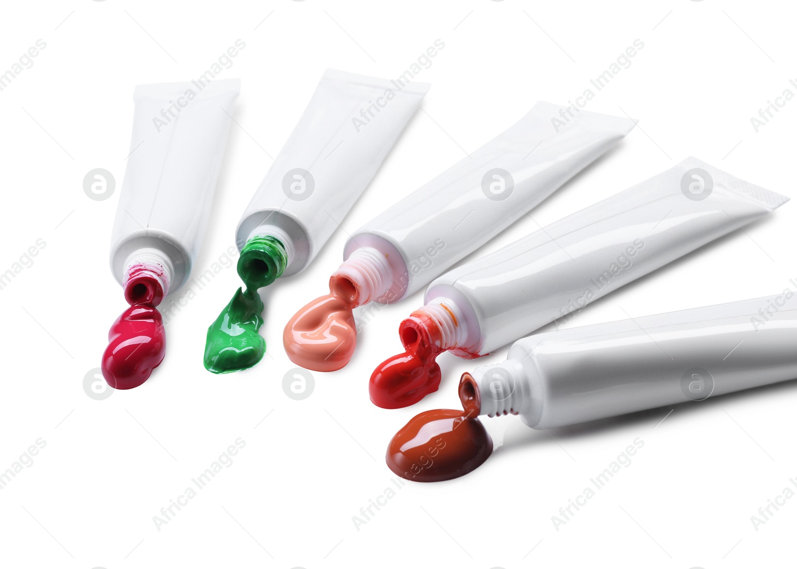 Photo of Many tubes with colorful paints isolated on white