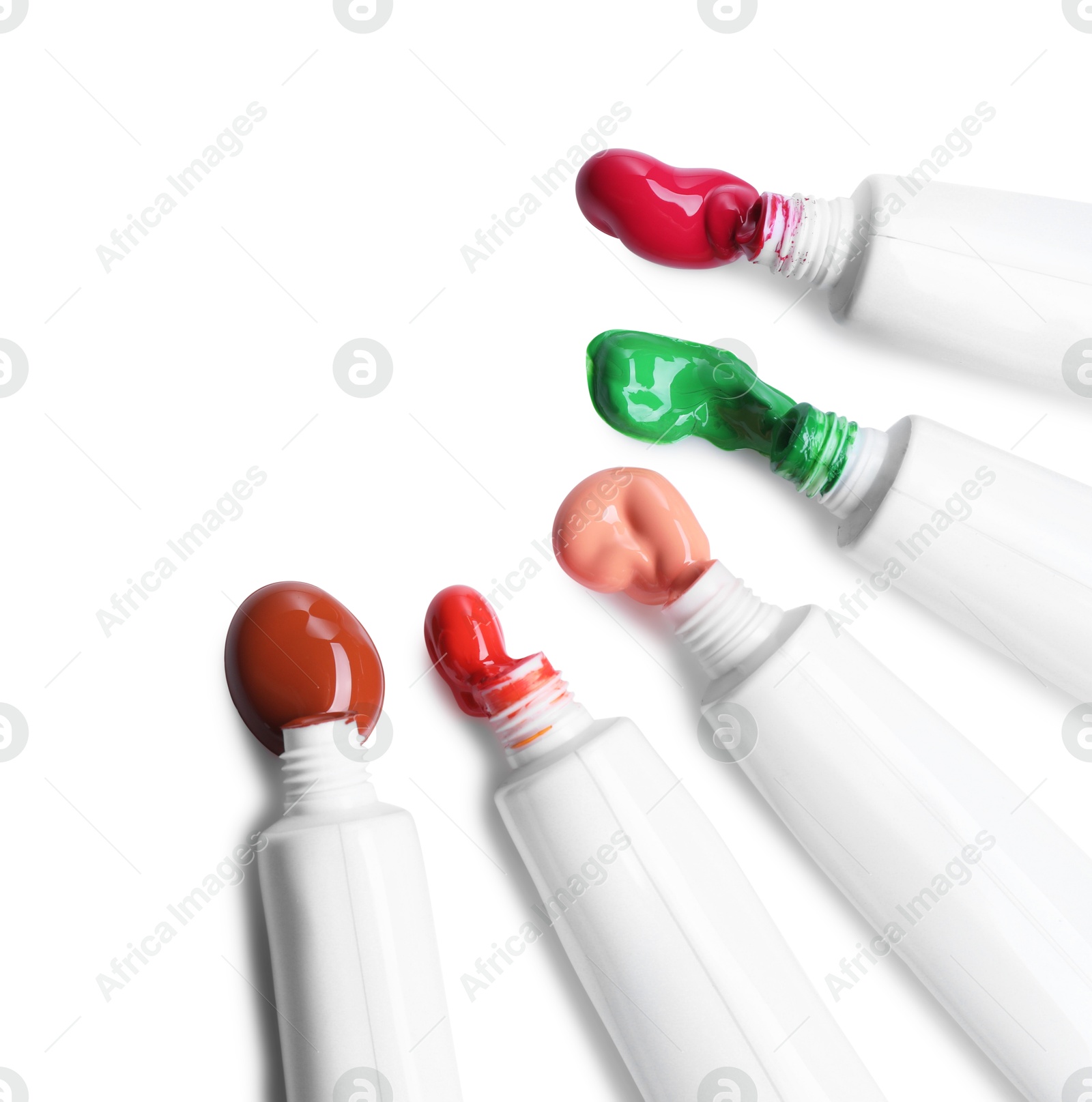 Photo of Tubes with colorful paints isolated on white, top view