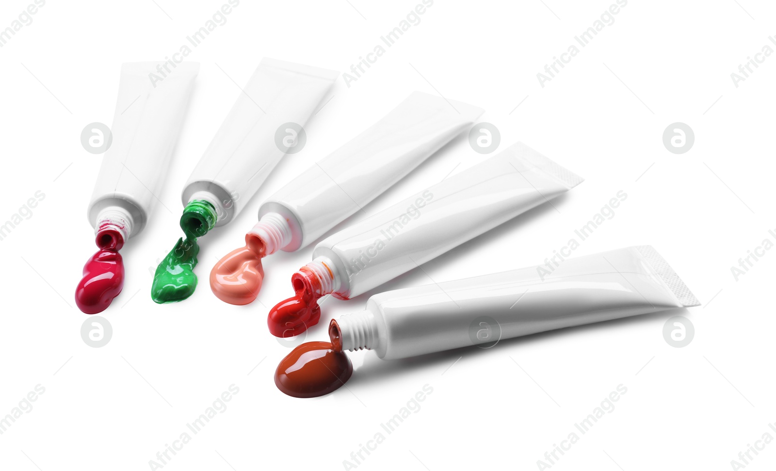 Photo of Many tubes with colorful paints isolated on white