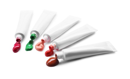 Photo of Many tubes with colorful paints isolated on white