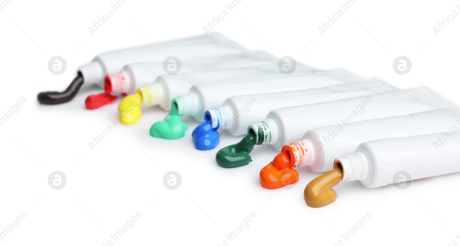 Photo of Tubes with colorful paints isolated on white