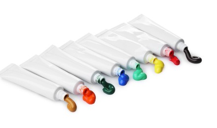 Photo of Tubes with colorful paints isolated on white