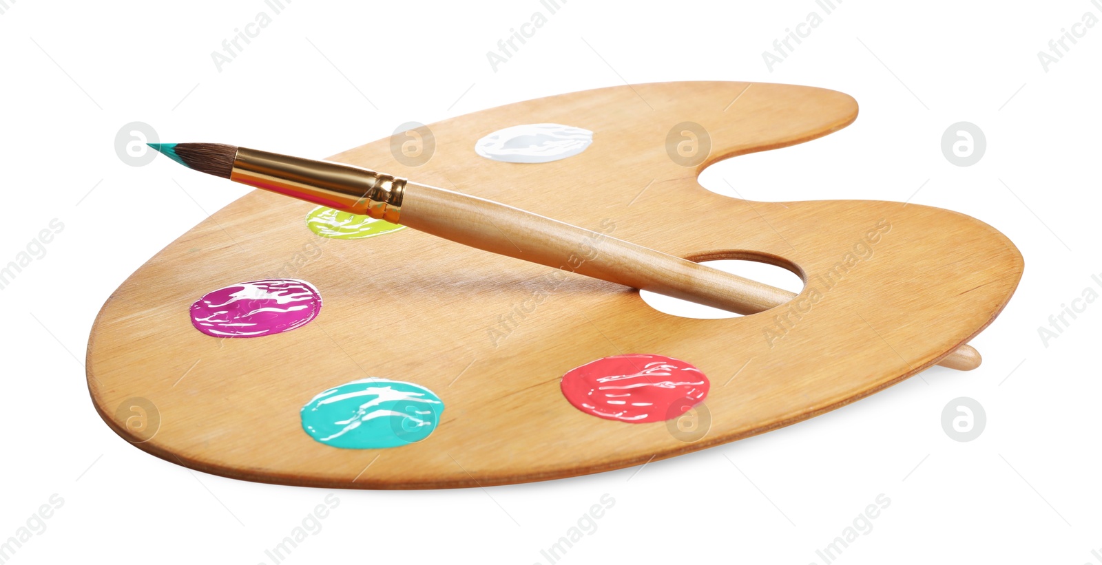 Photo of Wooden artist's palette with samples of paints and brush isolated on white