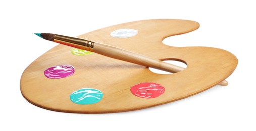 Photo of Wooden artist's palette with samples of paints and brush isolated on white