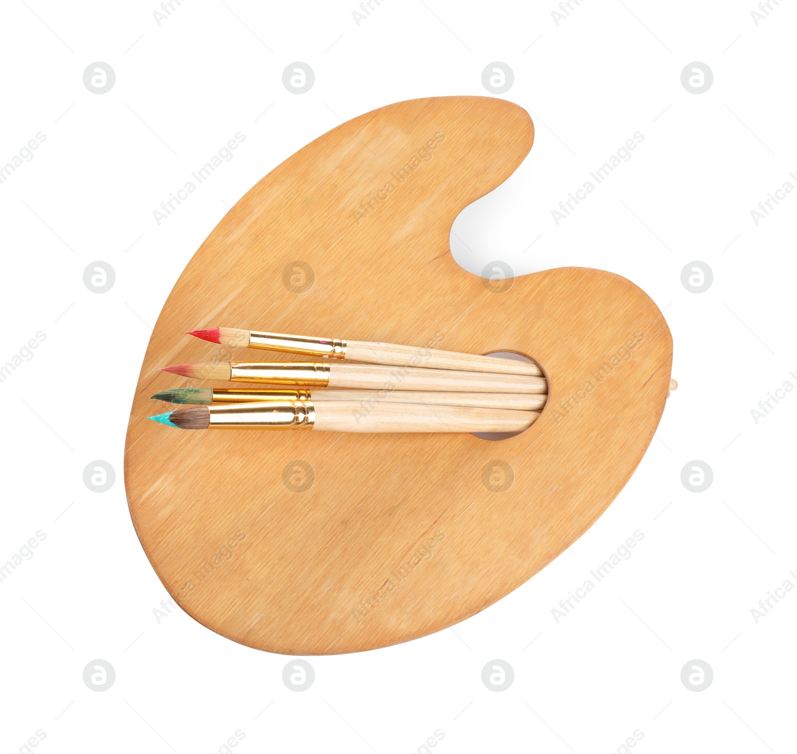 Photo of Brushes with paints and wooden palette isolated on white, top view