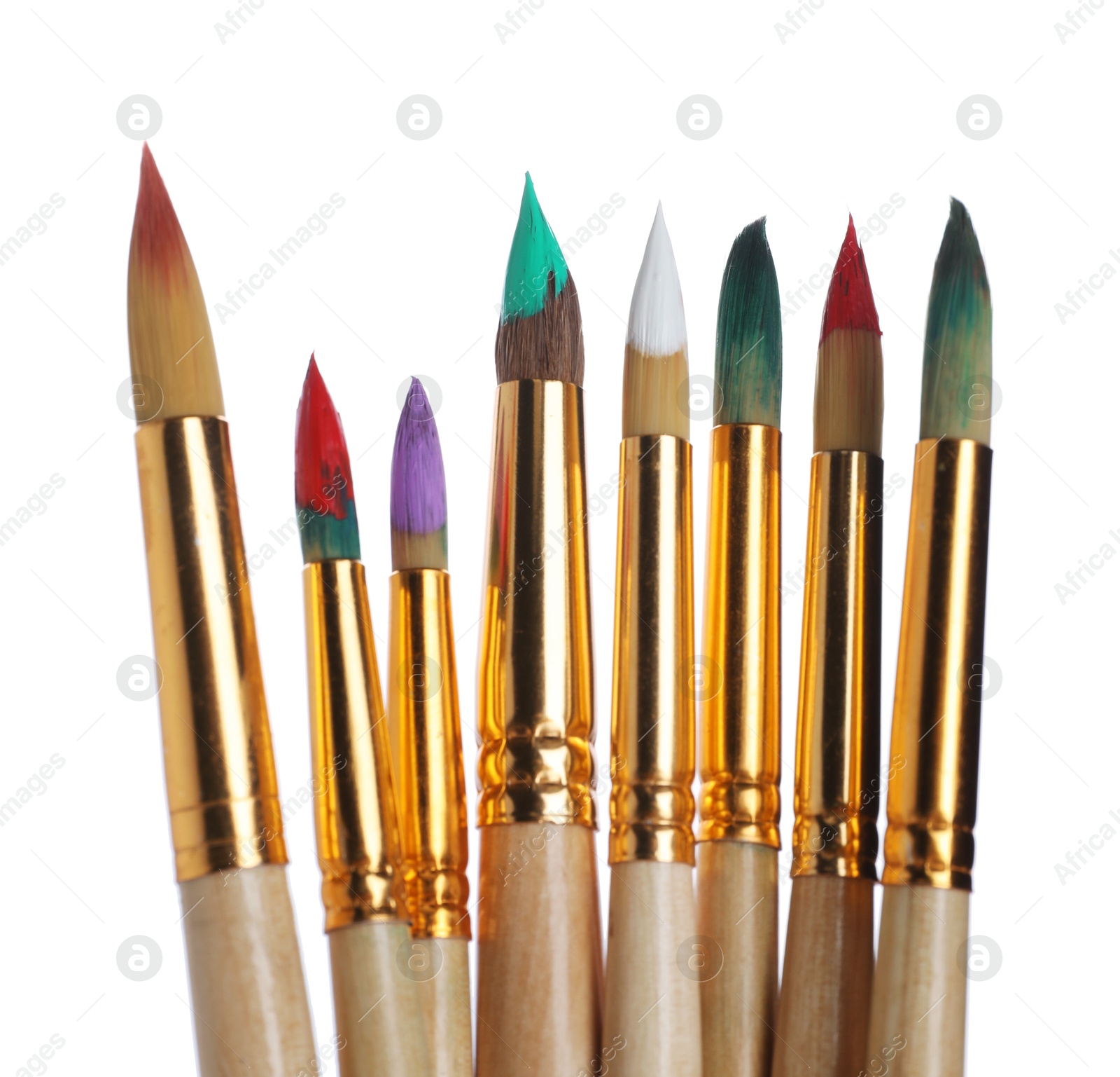 Photo of Wooden brushes with colorful paints isolated on white