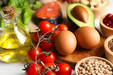 Photo of Many different healthy food on white table, closeup