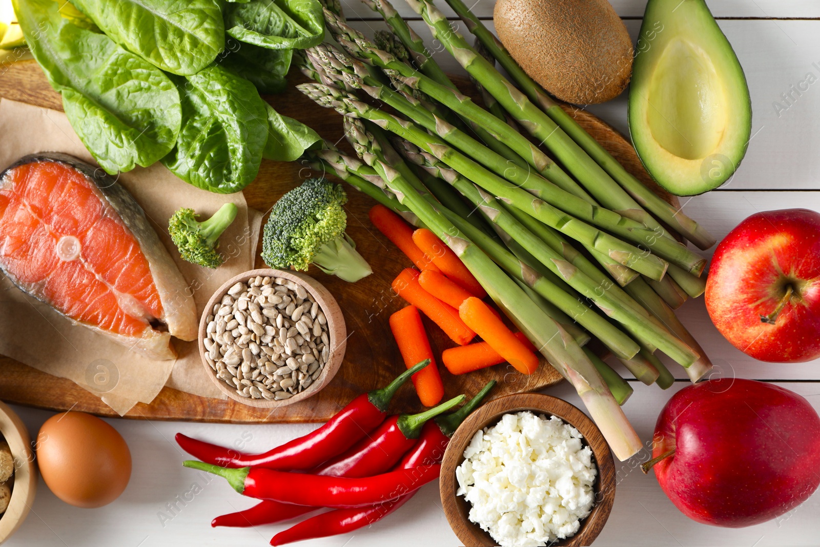 Photo of Many different healthy food on white wooden table, flat lay