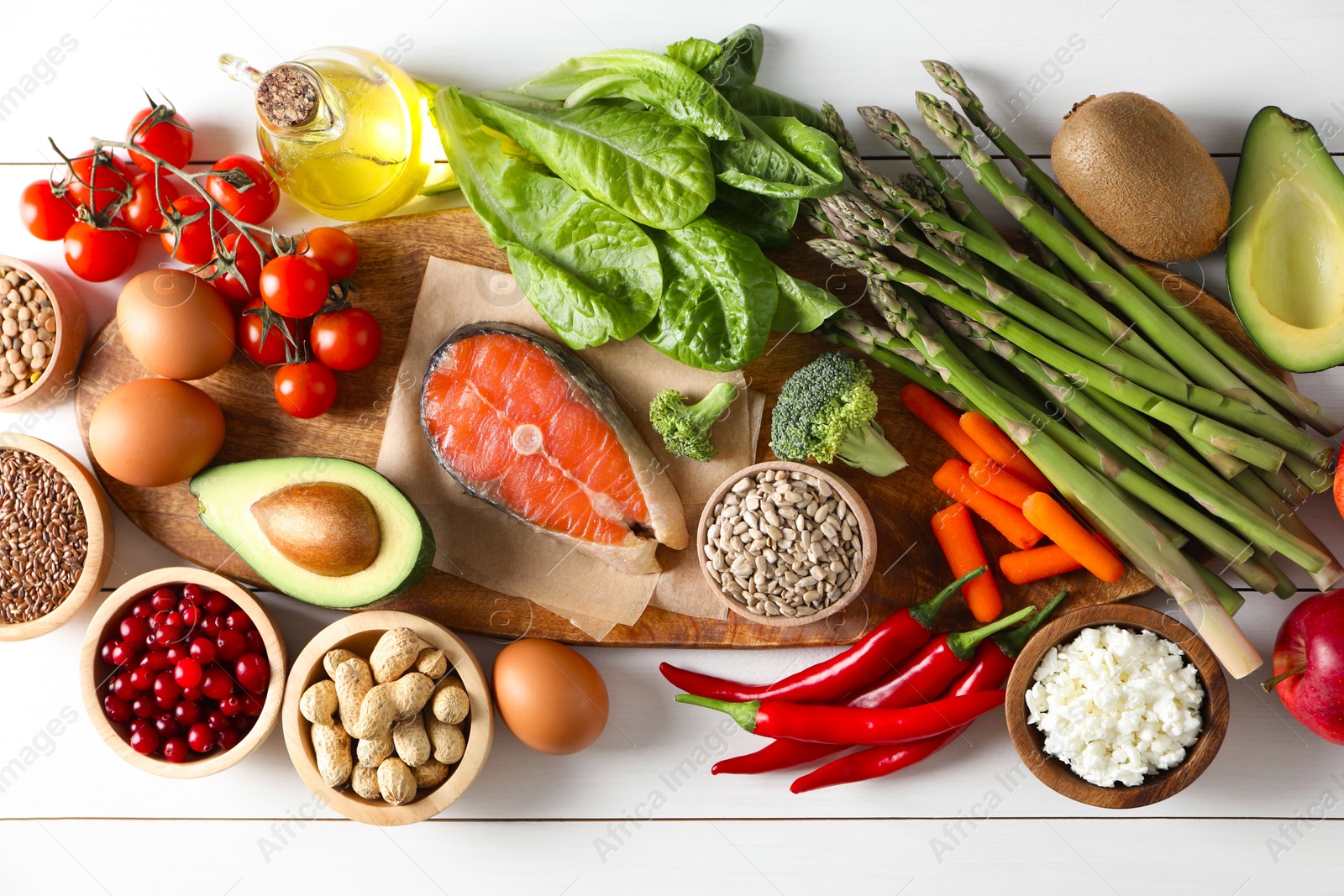 Photo of Many different healthy food on white wooden table, flat lay