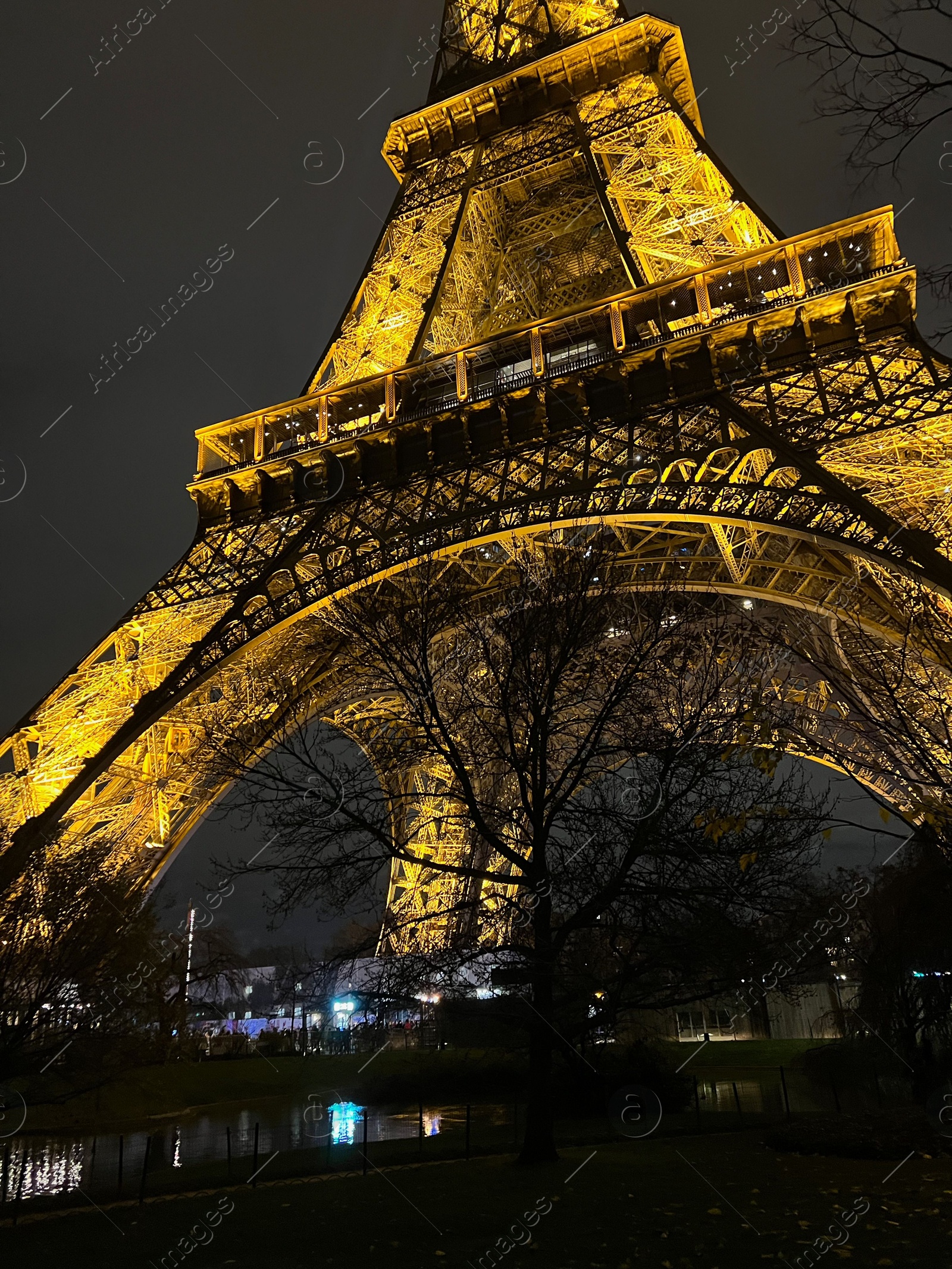 Photo of Beautiful illuminated Eiffel tower against night sky, low angle view