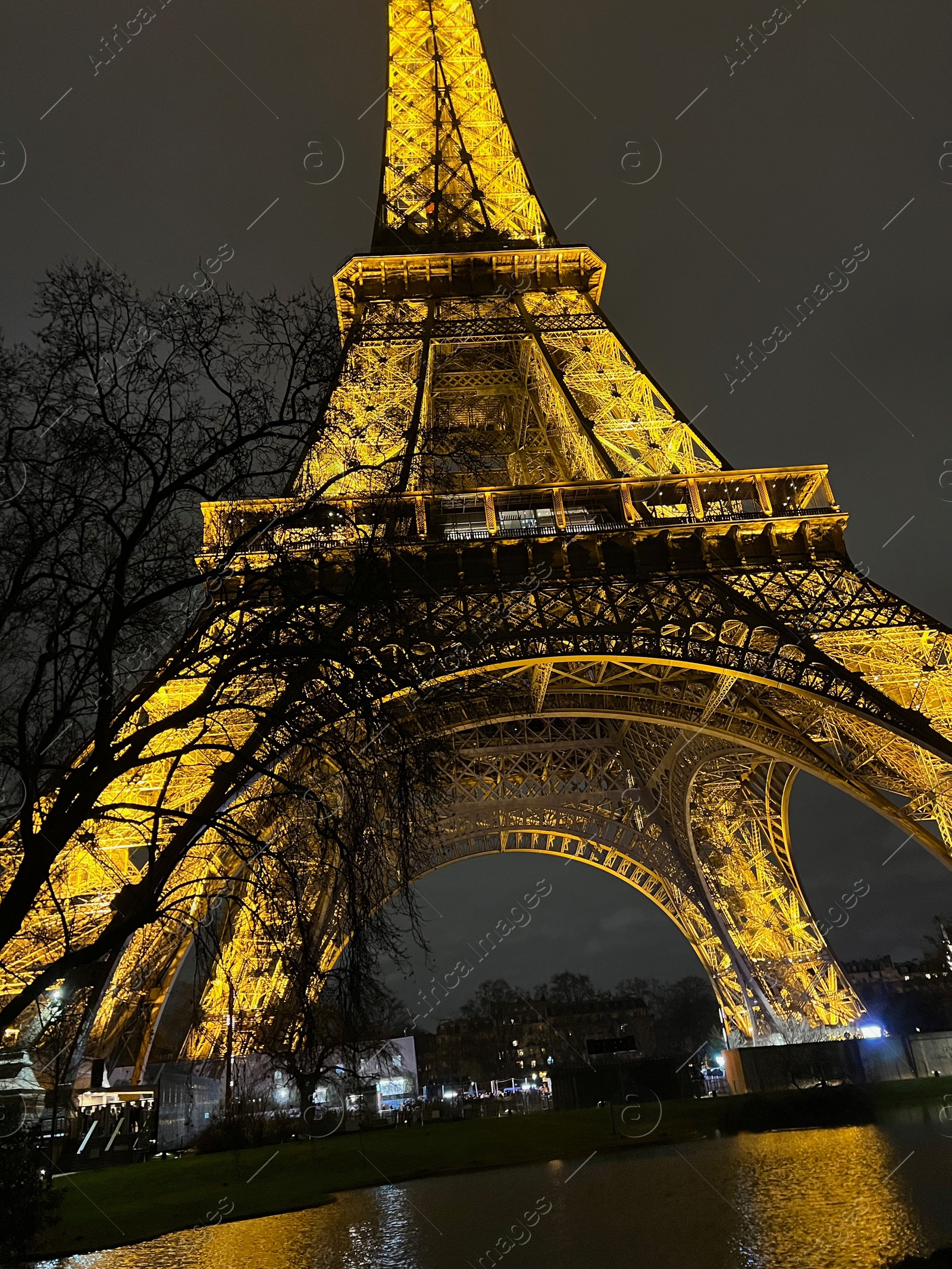 Photo of Beautiful illuminated Eiffel tower against night sky, low angle view