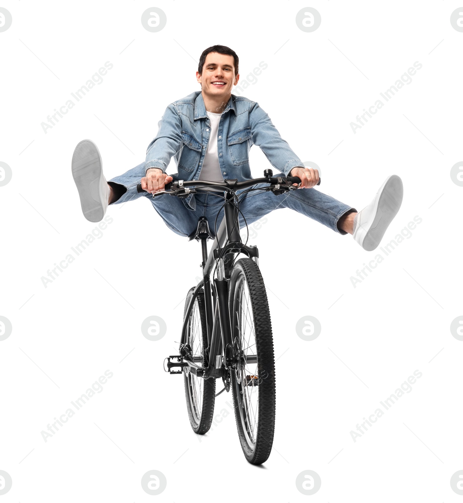 Photo of Smiling man having fun while riding bicycle on white background