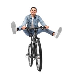 Smiling man having fun while riding bicycle on white background