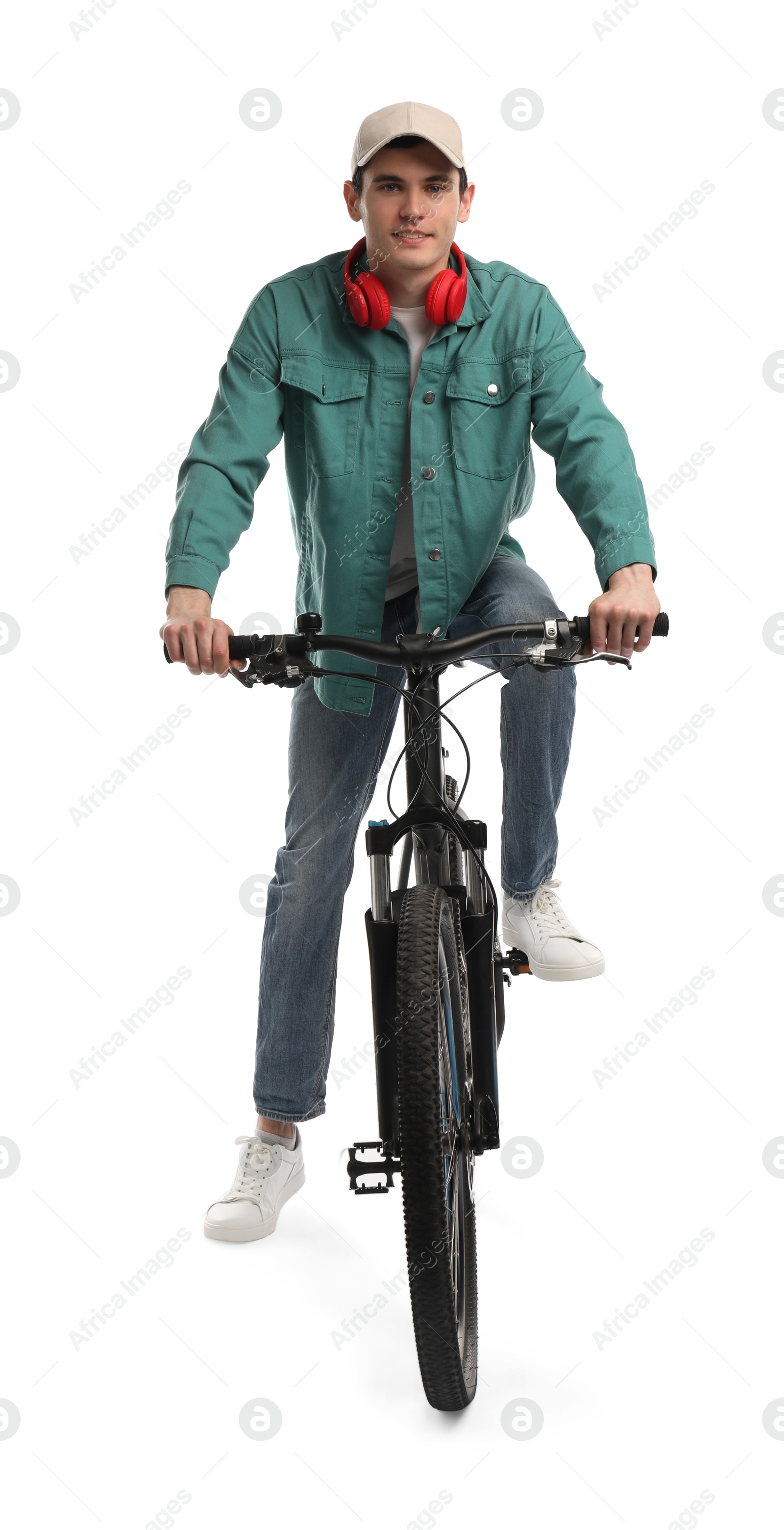 Photo of Man with headphones riding bicycle on white background